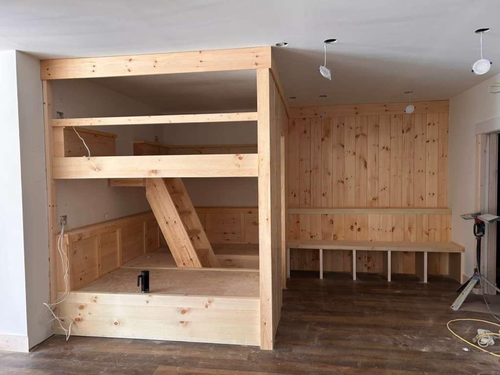 Built-in pine bunk beds with bench seating