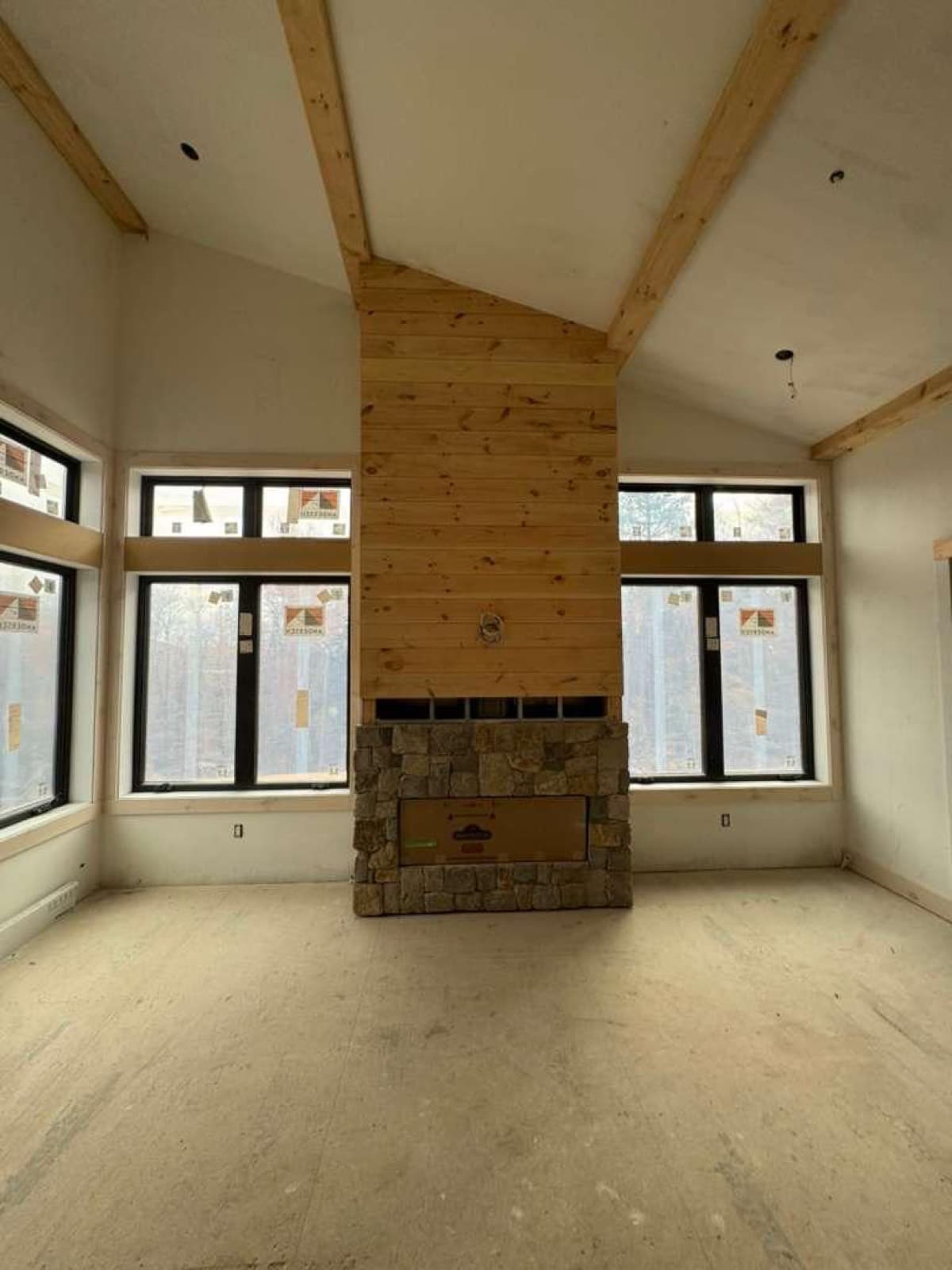 Vaulted great room with stone fireplace