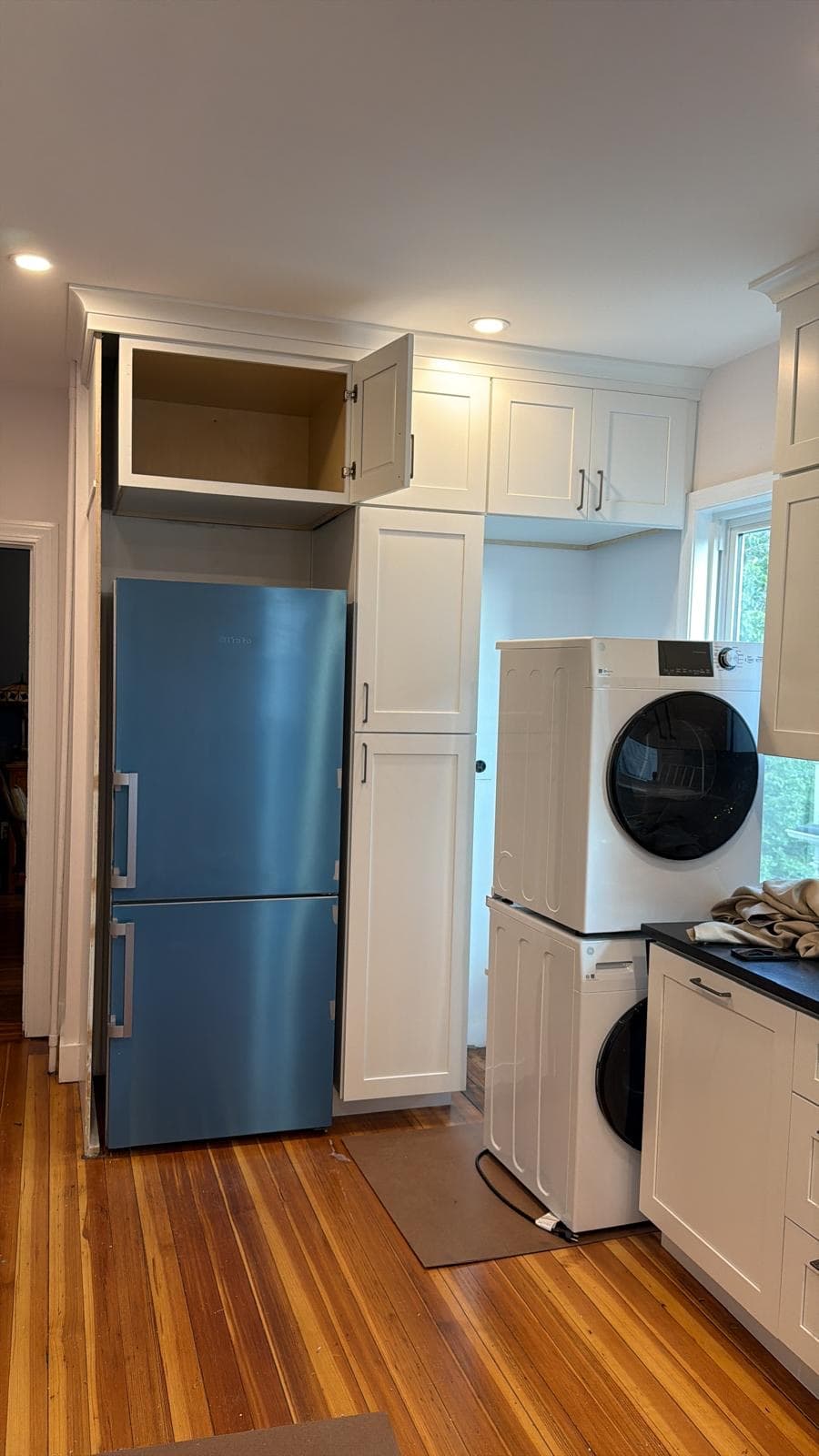Custom kitchen with pantry cabinets and laundry built-in