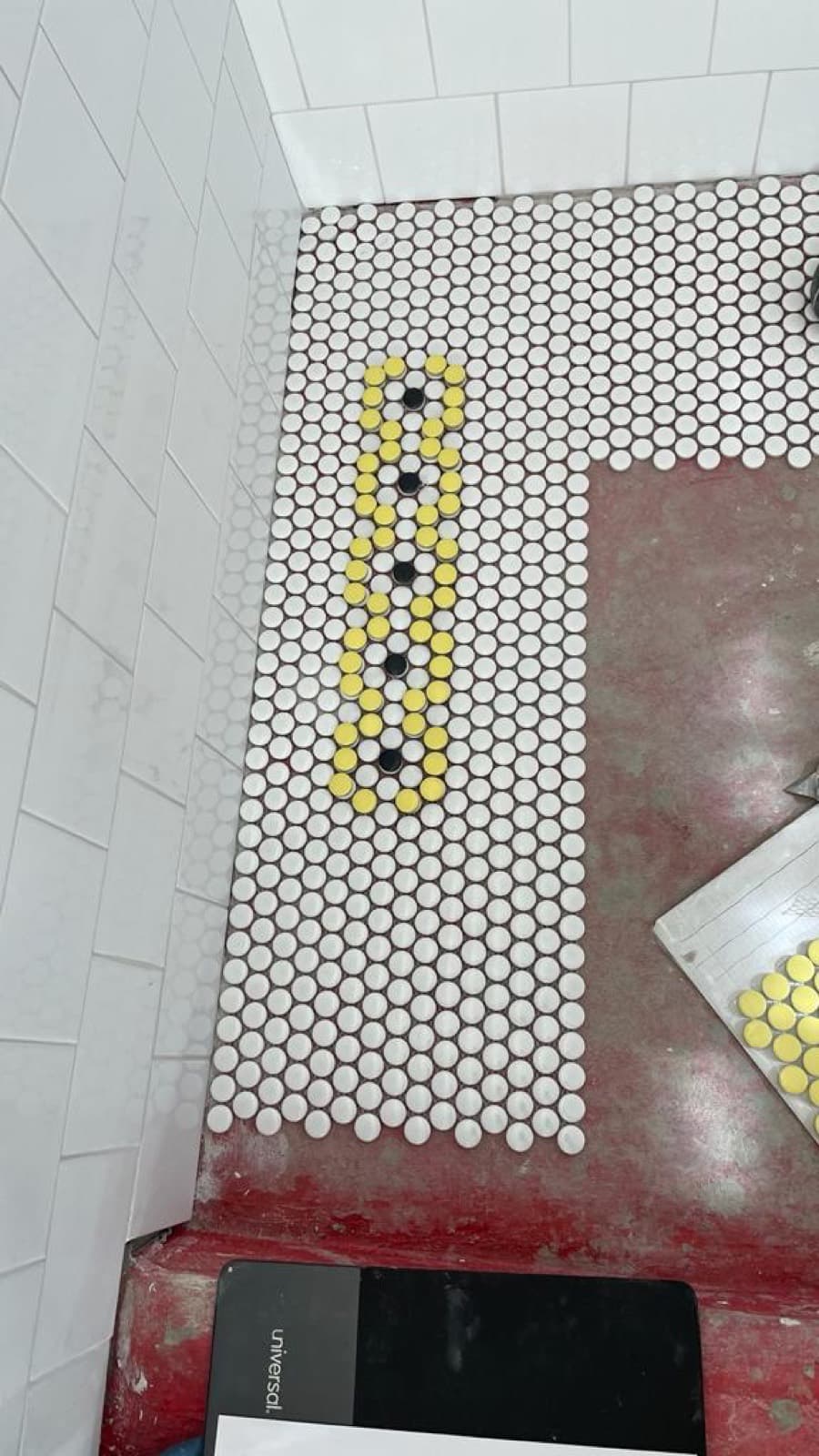White penny tile floor with custom color inlay