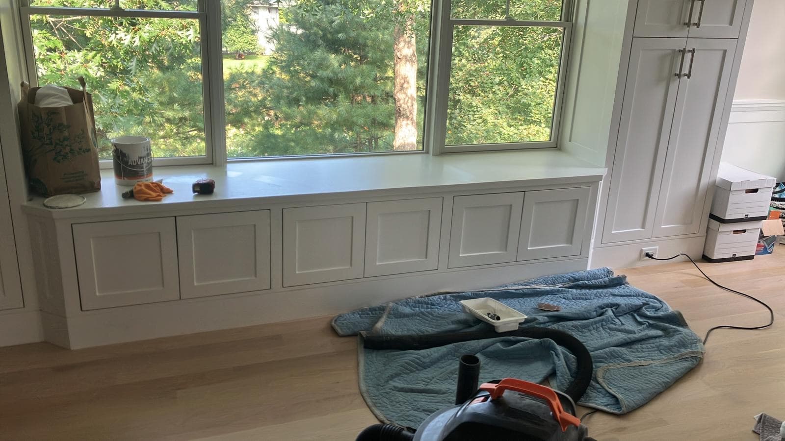Built-in window bench with shaker cabinet storage